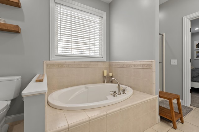 2693 Sanctuary Dr, Stevensville, MI 49127 - full bathroom with a garden tub, toilet, baseboards, and tile patterned floors