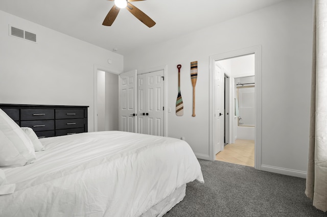2693 Sanctuary Dr, Stevensville, MI 49127 - bedroom featuring light carpet, ensuite bathroom, baseboards, visible vents, and a ceiling fan