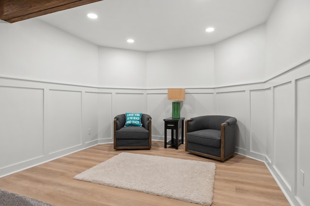 2693 Sanctuary Dr, Stevensville, MI 49127 - sitting room featuring a decorative wall, light wood-style flooring, a wainscoted wall, and recessed lighting