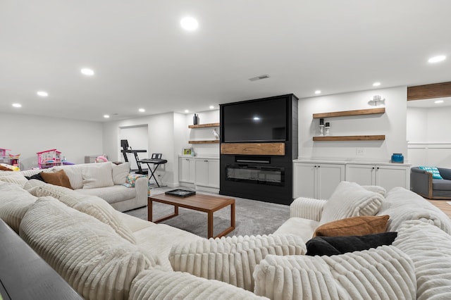 2693 Sanctuary Dr, Stevensville, MI 49127 - living room featuring a large fireplace, visible vents, and recessed lighting