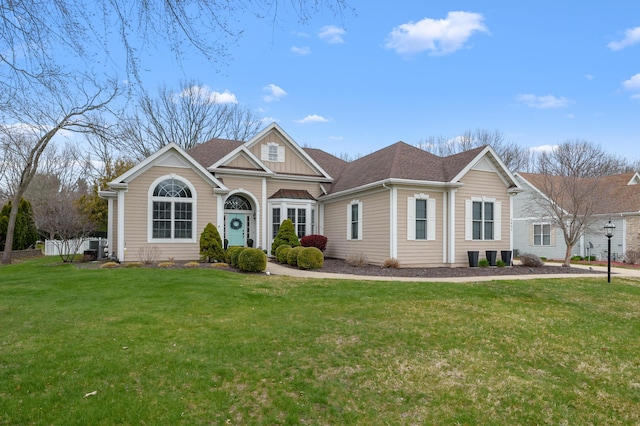 2693 Sanctuary Dr, Stevensville, MI 49127 - view of front of property with board and batten siding, a shingled roof, and a front lawn