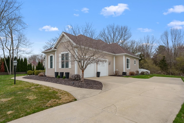 2693 Sanctuary Dr, Stevensville, MI 49127 - view of side of home featuring a garage, driveway, and a lawn