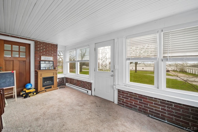 unfurnished sunroom with a baseboard radiator