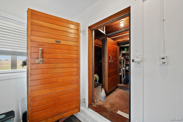 hall with concrete floors