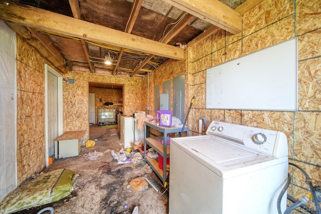 clothes washing area featuring washer / clothes dryer, electric panel, and laundry area