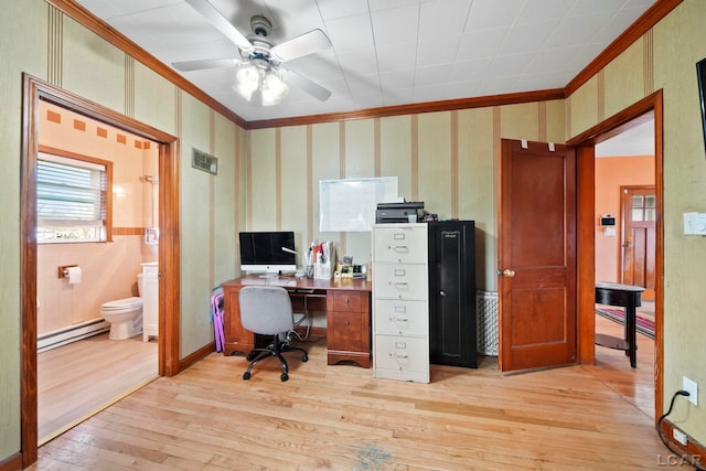 office space featuring light wood-type flooring, a ceiling fan, a baseboard radiator, and crown molding