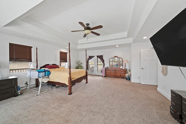 bedroom featuring recessed lighting, a raised ceiling, access to exterior, a ceiling fan, and carpet floors
