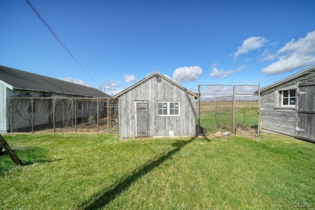 view of shed featuring fence