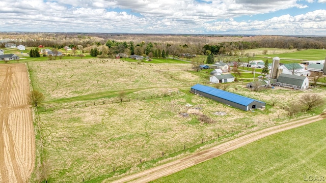 birds eye view of property with a rural view