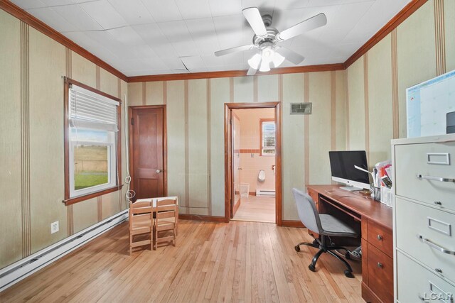 office space with light wood-type flooring, baseboard heating, and ornamental molding