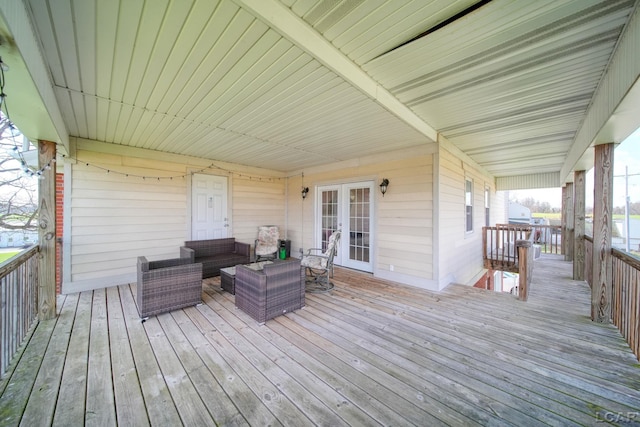 wooden deck with outdoor lounge area and french doors