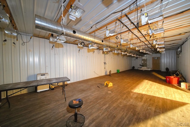 below grade area featuring wood finished floors