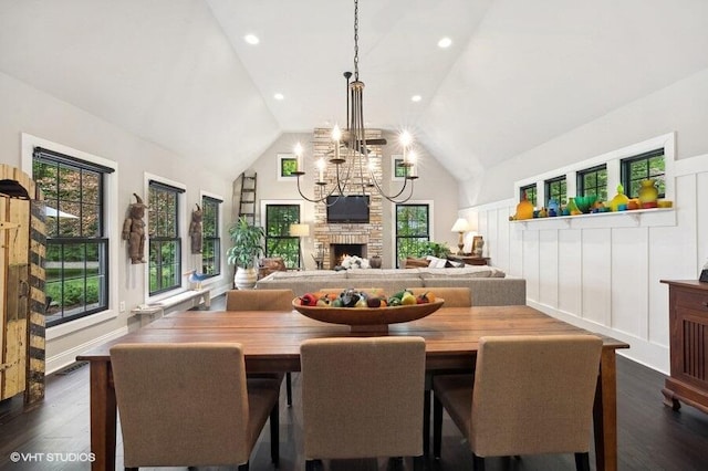 16191 4th Ln, Union Pier, MI 49129 - dining area with an inviting chandelier, dark wood-style flooring, a stone fireplace, and visible vents