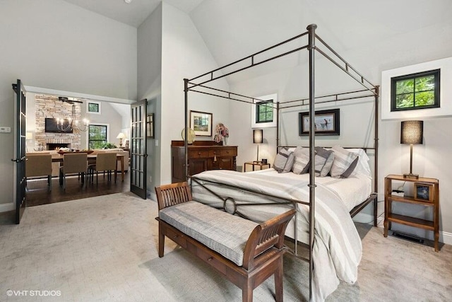 16191 4th Ln, Union Pier, MI 49129 - bedroom with high vaulted ceiling, baseboards, and a fireplace
