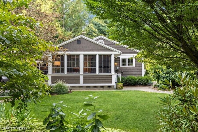 16191 4th Ln, Union Pier, MI 49129 - rear view of property with a sunroom and a yard