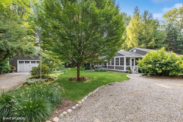 16191 4th Ln, Union Pier, MI 49129 - view of front of home with driveway, a front lawn, and a detached garage