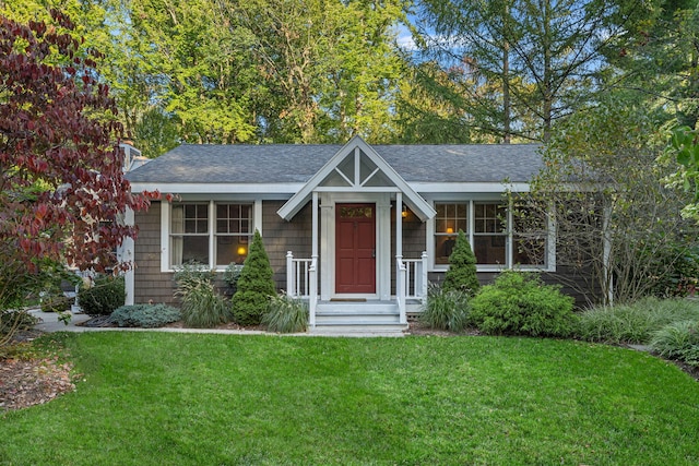16191 4th Ln, Union Pier, MI 49129 - view of front of home featuring a shingled roof, a front lawn, and a chimney