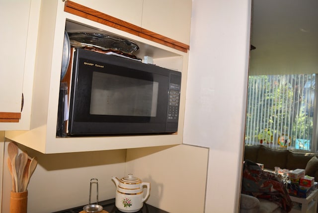 interior details featuring black microwave