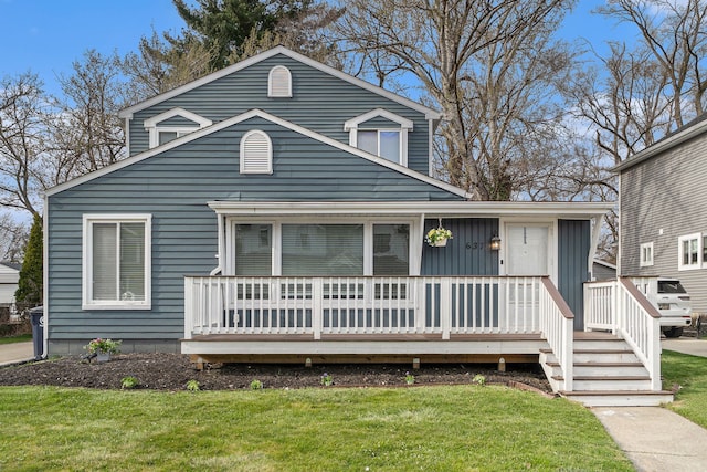 view of front of house featuring a front lawn and board and batten siding
