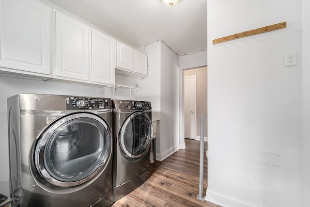 laundry room with independent washer and dryer, cabinet space, wood finished floors, and baseboards