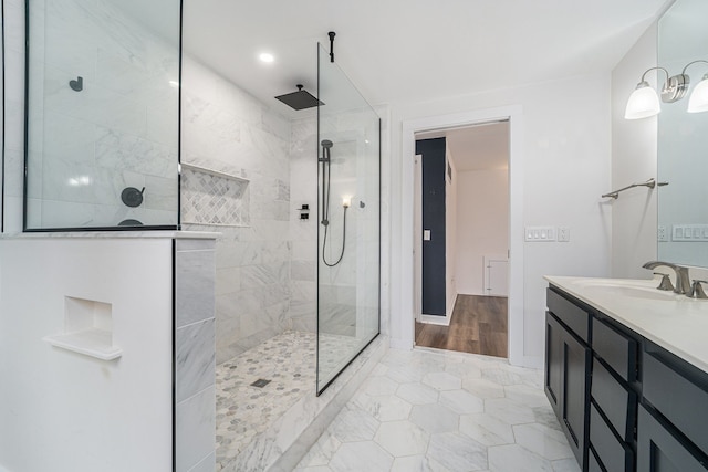 bathroom with walk in shower, tile patterned flooring, vanity, and recessed lighting