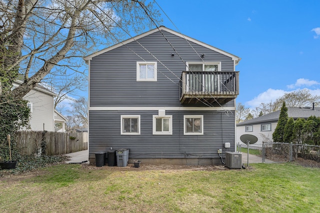 back of house with a balcony and central AC