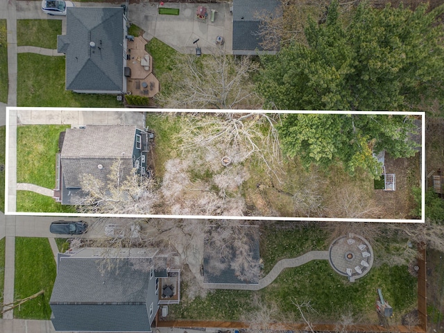 aerial view of property and surrounding area featuring property boundaries highlighted