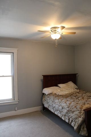 5815 Cadillac Ave, Detroit, MI 48213 - bedroom with carpet flooring, ceiling fan, and baseboards