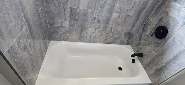 full bathroom featuring a washtub and walk in shower