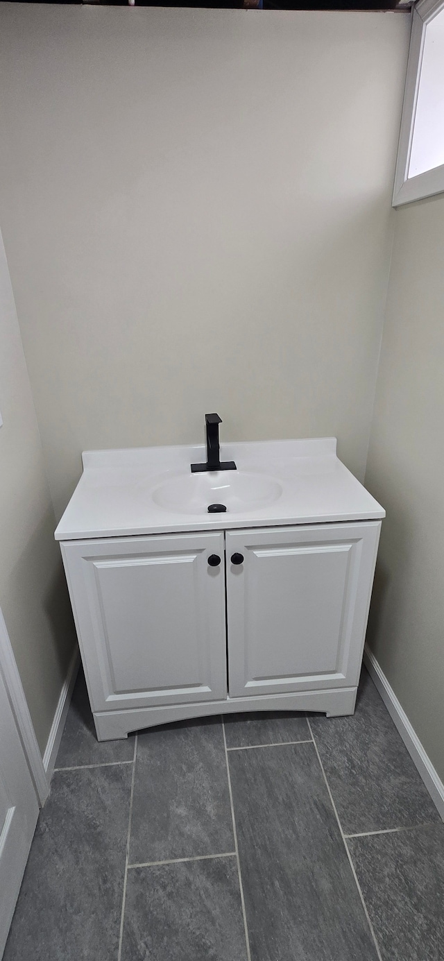 room details with baseboards and a sink