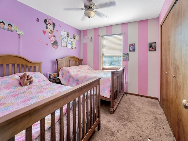 bedroom with a ceiling fan, baseboards, a closet, and light colored carpet
