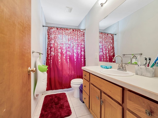 bathroom with toilet, vanity, tile patterned floors, and curtained shower