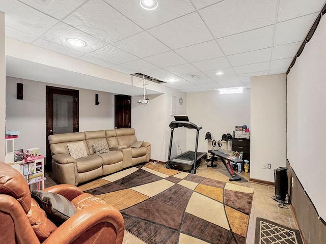 living room with recessed lighting and a drop ceiling