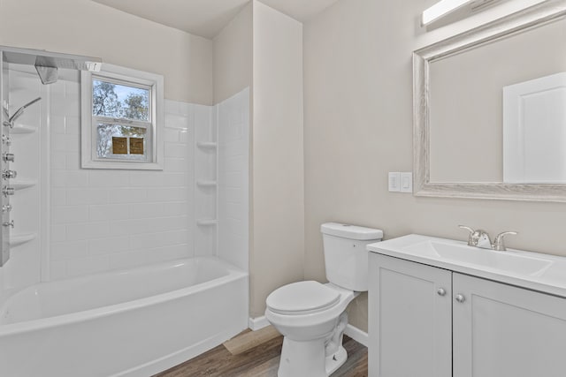 full bathroom featuring wood finished floors, shower / bathtub combination, toilet, vanity, and baseboards
