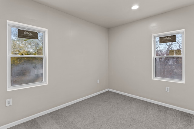 spare room featuring baseboards, carpet floors, and recessed lighting