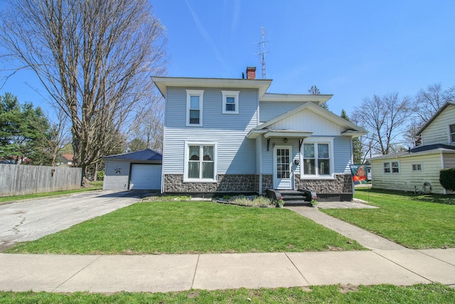 view of front of house featuring a detached garage, stone siding, a chimney, fence, and aphalt driveway