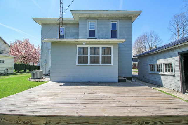 wooden terrace with a yard and cooling unit