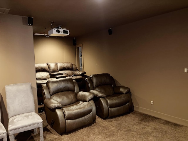carpeted cinema with baseboards