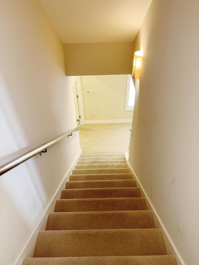 stairs with carpet flooring and baseboards