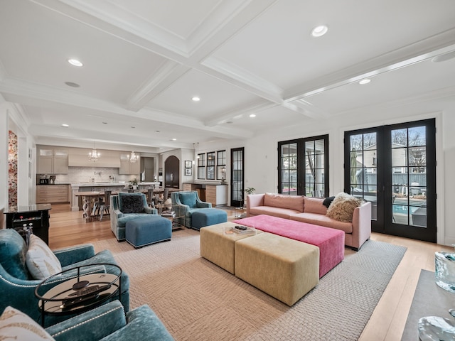 living area with light wood-type flooring, recessed lighting, coffered ceiling, and beamed ceiling
