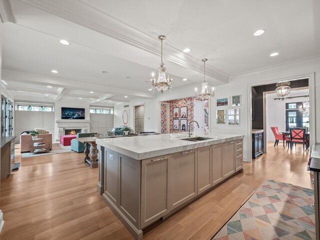 457 Catalpa Dr, Birmingham, MI 48009 - kitchen with a sink, a chandelier, gray cabinetry, ornamental molding, and recessed lighting