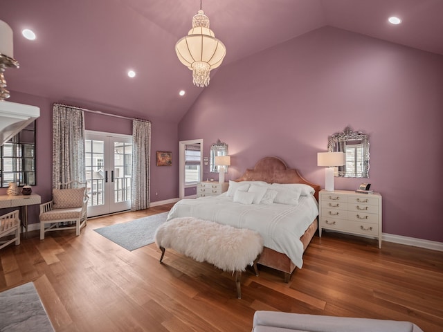 bedroom featuring recessed lighting, access to exterior, french doors, high vaulted ceiling, and a notable chandelier