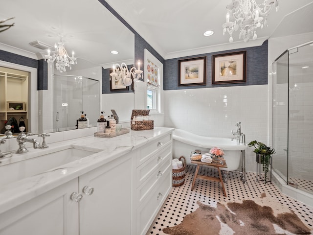 457 Catalpa Dr, Birmingham, MI 48009 - full bathroom featuring a chandelier, a shower stall, ornamental molding, a freestanding tub, and vanity