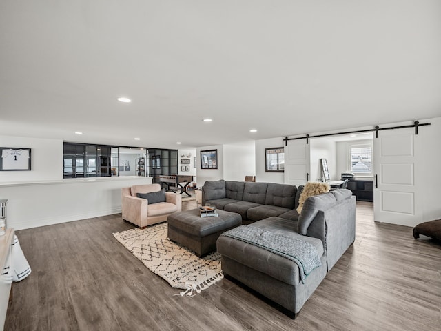 457 Catalpa Dr, Birmingham, MI 48009 - living area with a barn door, wood finished floors, recessed lighting, and baseboards