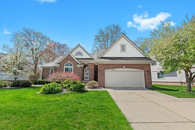 traditional home with a garage, concrete driveway, a front lawn, and brick siding