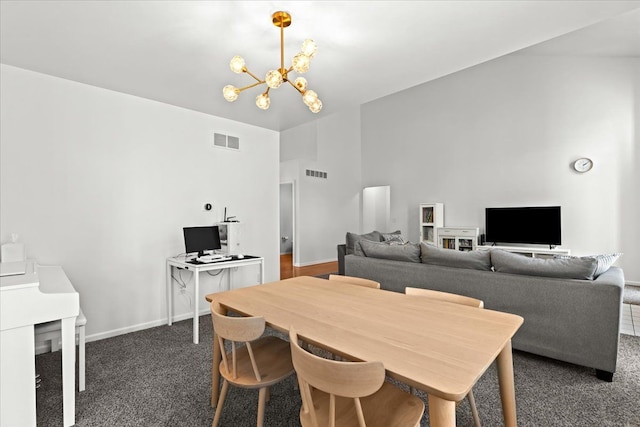 dining space featuring visible vents, carpet flooring, and a notable chandelier