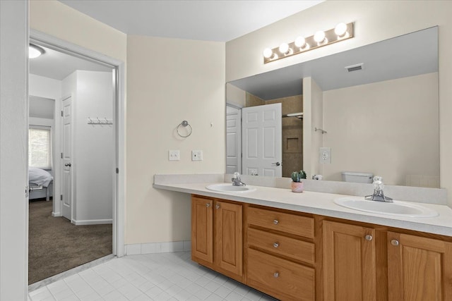 full bath featuring visible vents, a sink, tile patterned floors, and double vanity
