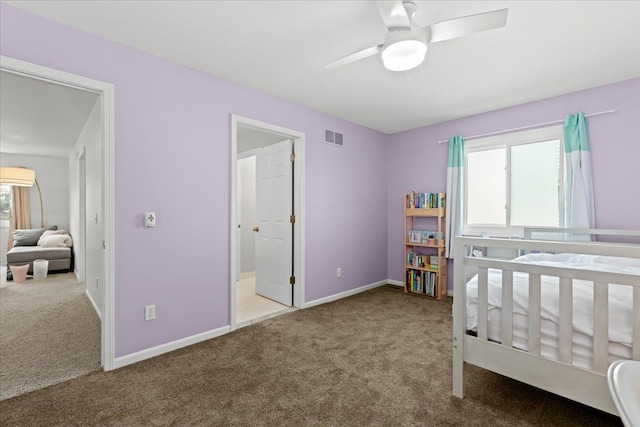 bedroom with baseboards, ceiling fan, carpet flooring, and visible vents