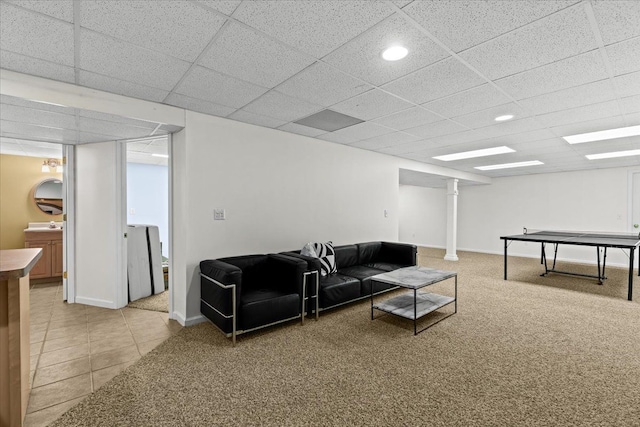 living area featuring light tile patterned flooring, baseboards, recessed lighting, light colored carpet, and a paneled ceiling