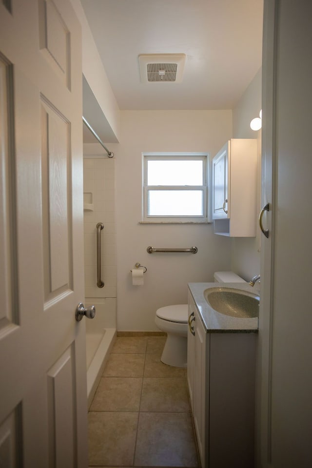 full bathroom with visible vents, walk in shower, toilet, tile patterned floors, and vanity